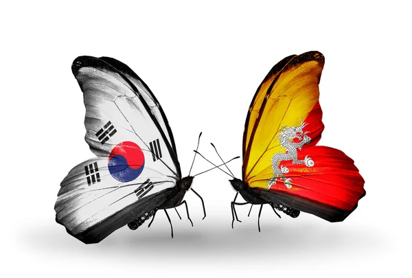 Dos mariposas con banderas en alas como símbolo de relaciones Corea del Sur y Bután —  Fotos de Stock