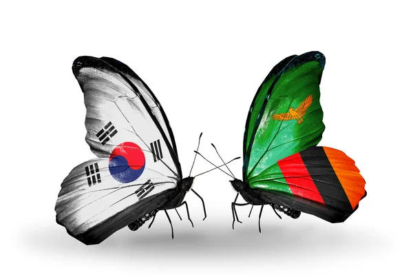 Dos mariposas con banderas en alas como símbolo de relaciones Corea del Sur y Zambia — Foto de Stock