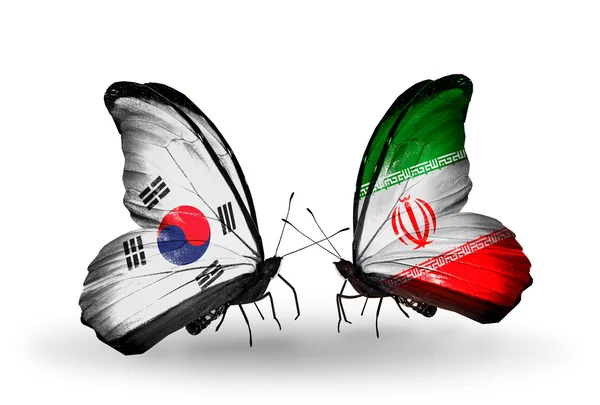 Dos mariposas con banderas en las alas como símbolo de las relaciones Corea del Sur e Irán — Foto de Stock