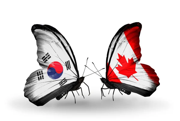 Dos mariposas con banderas en alas como símbolo de relaciones Corea del Sur y Canadá —  Fotos de Stock