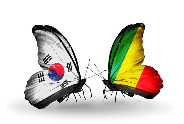 Twee vlinders met vlaggen op vleugels als symbool van de betrekkingen, Zuid-korea en kongo — Stockfoto