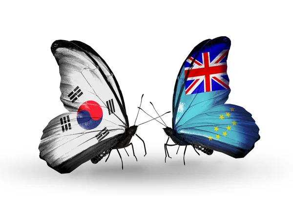 Due farfalle con bandiere sulle ali come simbolo delle relazioni Corea del Sud e Figi — Foto Stock
