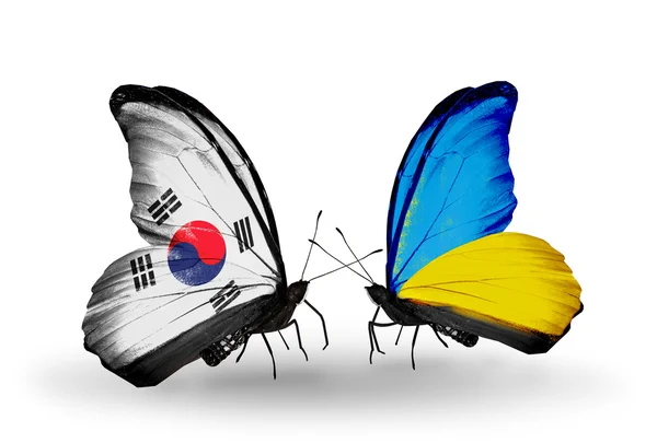 Two butterflies with flags on wings as symbol of relations South Korea and Ukraine — Stock Photo, Image