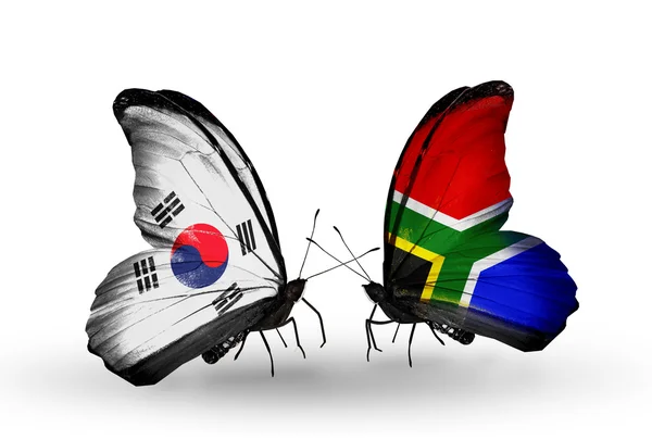 Two butterflies with flags on wings as symbol of relations South Korea and South Africa — Stock Photo, Image