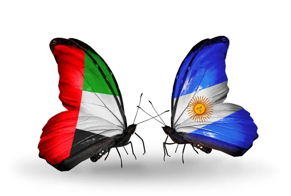 Twee vlinders met vlaggen op vleugels als symbool van betrekkingen uae en Argentinië — Stockfoto
