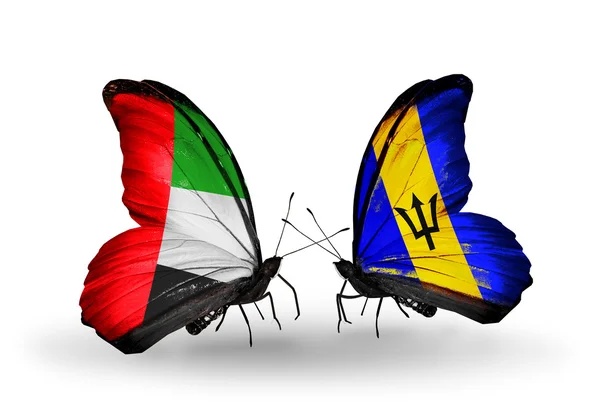 Due farfalle con bandiere sulle ali come simbolo delle relazioni Emirati Arabi Uniti e Barbados — Foto Stock