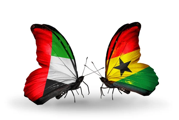 Two butterflies with flags on wings as symbol of relations UAE and Ghana — Stock Photo, Image