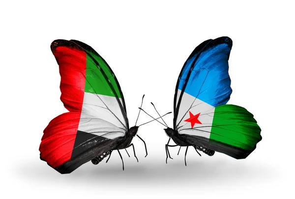 Dwa motyle z flagami na skrzydłach jako symbol Zjednoczonych Emiratów Arabskich stosunków i Dżibuti — Zdjęcie stockowe