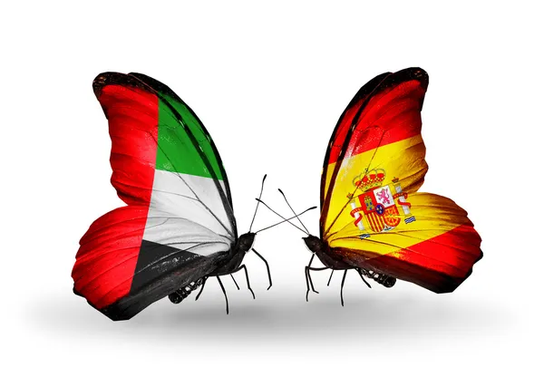 Dos mariposas con banderas en alas como símbolo de relaciones Emiratos Árabes Unidos y España — Foto de Stock