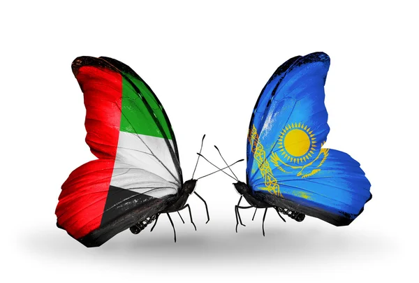 Dva motýli s příznaky na křídlech jako symbol vztahy SAE a Kazachstánu — Stock fotografie