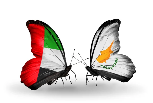 Two butterflies with flags on wings as symbol of relations UAE and Cyprus — Stock Photo, Image