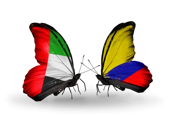 Duas borboletas com bandeiras em asas como símbolo de relações Emirados Árabes Unidos e Columbia — Fotografia de Stock