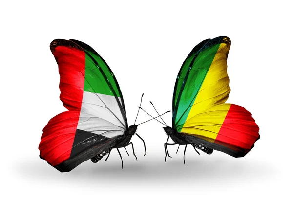 Duas borboletas com bandeiras em asas como símbolo de relações Emirados Árabes Unidos e Kongo — Fotografia de Stock