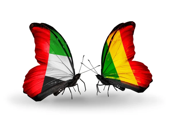 Twee vlinders met vlaggen op vleugels als symbool van betrekkingen uae en mali — Stockfoto