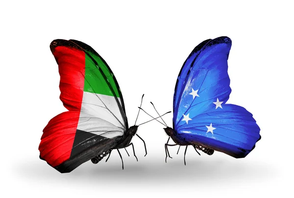 Dos mariposas con banderas en alas como símbolo de relaciones Emiratos Árabes Unidos y Micronesia —  Fotos de Stock