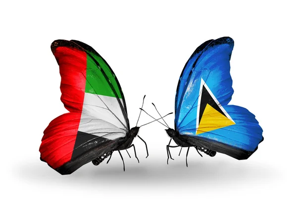 Deux papillons avec des drapeaux sur les ailes comme symbole des relations EAU et Sainte-Lucie — Photo