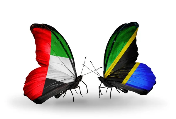 Dos mariposas con banderas en alas como símbolo de relaciones Emiratos Árabes Unidos y Tanzania —  Fotos de Stock