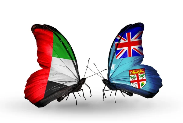 Duas borboletas com bandeiras em asas como símbolo de relações Emirados Árabes Unidos e Fiji — Fotografia de Stock