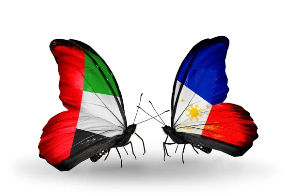 Two butterflies with flags on wings as symbol of relations UAE and Philippines — Stock Photo, Image