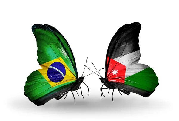 Dos mariposas con banderas en alas como símbolo de relaciones Brasil y Jordania — Foto de Stock