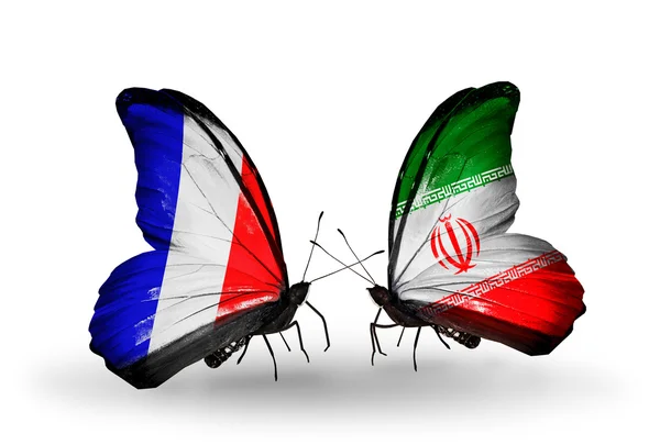 Deux papillons avec des drapeaux sur les ailes comme symbole des relations France et Iran — Photo