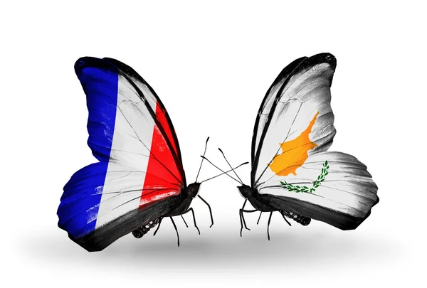 Two butterflies with flags on wings as symbol of relations France and Cyprus — Stock Photo, Image