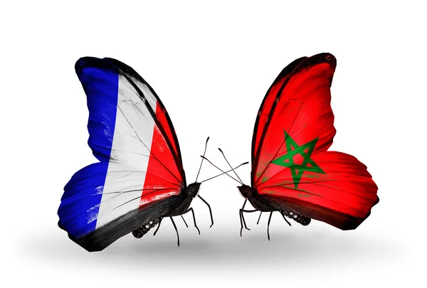 Dos mariposas con banderas en alas como símbolo de relaciones Francia y Marruecos —  Fotos de Stock