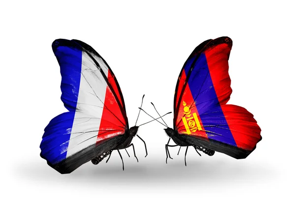 Dos mariposas con banderas en alas como símbolo de relaciones Francia y Mongolia —  Fotos de Stock