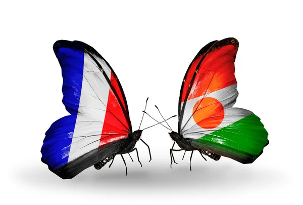 Two butterflies with flags on wings as symbol of relations France and Niger — Stock Photo, Image