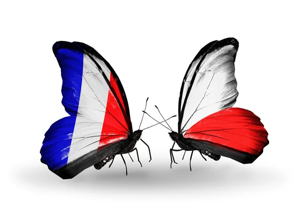 Two butterflies with flags on wings as symbol of relations France and Poland — Stock Photo, Image