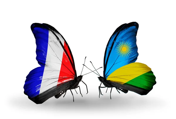 Two butterflies with flags on wings as symbol of relations France and Rwanda — Stock Photo, Image