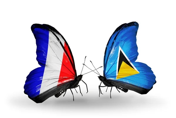 Два метелики з прапорами на крилах як символ відносин, Франція і Сент-Люсія — стокове фото