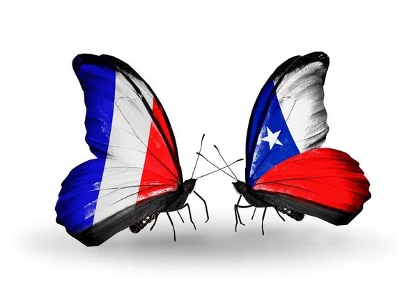 Dos mariposas con banderas en alas como símbolo de relaciones Francia y Chile —  Fotos de Stock