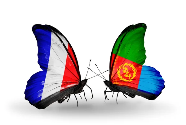 Two butterflies with flags on wings as symbol of relations France and Eritrea — Stock Photo, Image