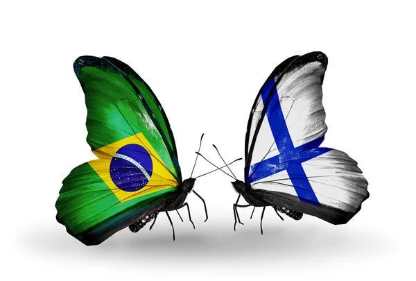 Two butterflies with flags on wings as symbol of relations Brazil and Finland — Stock Photo, Image