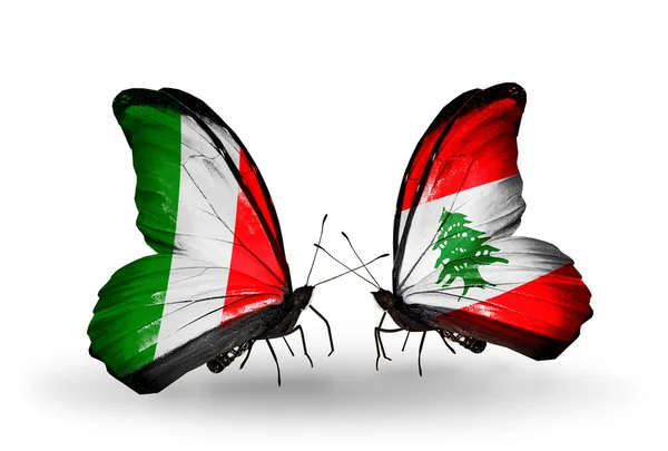 Two butterflies with flags on wings as symbol of relations Italy and Lebanon — Stock Photo, Image