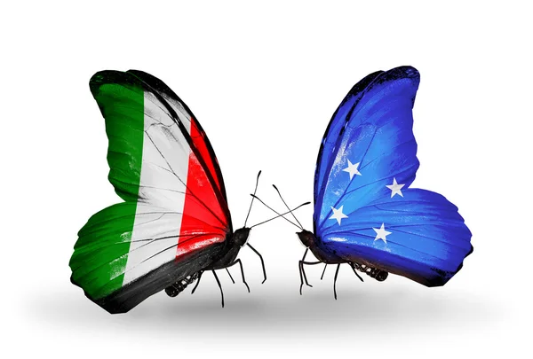 Two butterflies with flags on wings as symbol of relations Italy and Micronesia — Stock Photo, Image