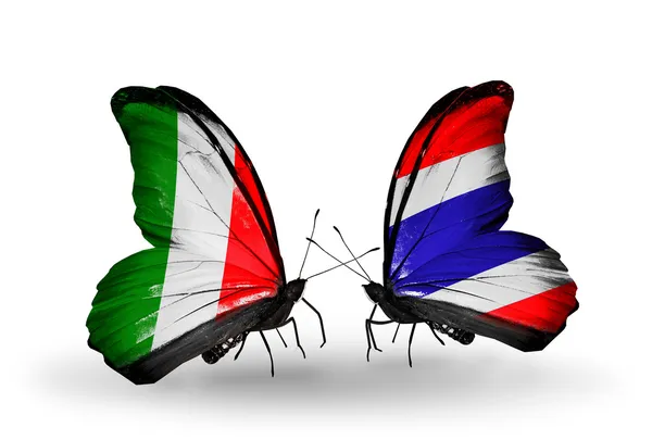 Two butterflies with flags on wings as symbol of relations Italy and Thailand — Stock Photo, Image