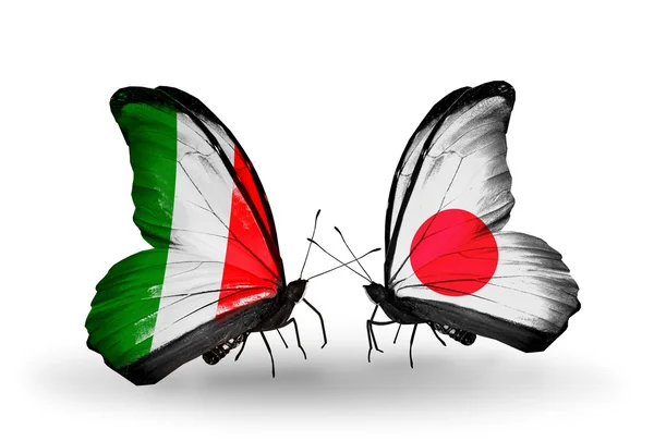 Two butterflies with flags on wings as symbol of relations Italy and Japan — Stock Photo, Image