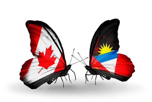 Two butterflies with flags on wings as symbol of relations Canada and Antigua and Barbuda — Stock Photo, Image