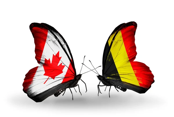 Dos mariposas con banderas en alas como símbolo de relaciones Canadá y Bélgica — Foto de Stock