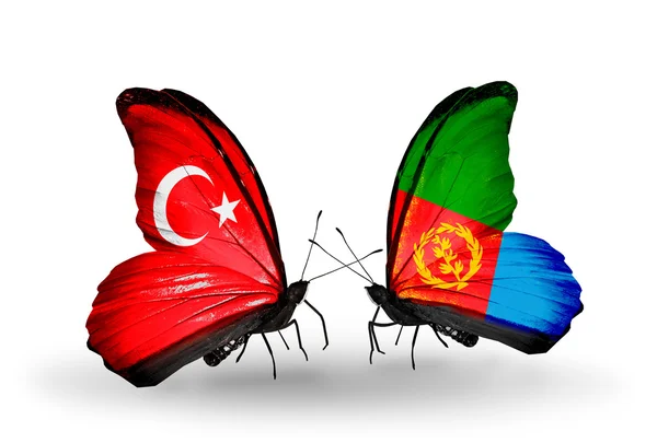 Dva motýli s příznaky na křídlech jako symbol vztahy Turecka a eritrea — Stock fotografie