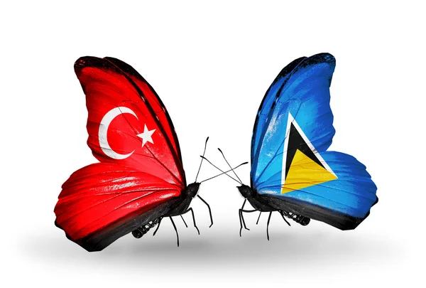 Two butterflies with flags on wings as symbol of relations Turkey and Saint Lucia — Stock Photo, Image