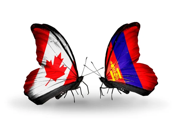 Due farfalle con bandiere sulle ali come simbolo delle relazioni Canada e Mongolia — Foto Stock