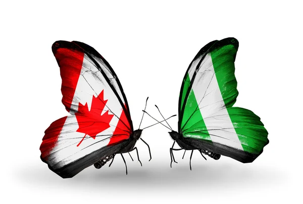 2 つの蝶の翼上のフラグとの関係の記号としてカナダ、ナイジェリア — ストック写真