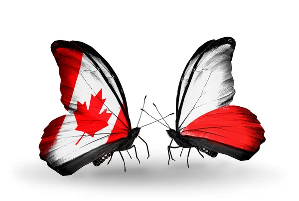 Duas borboletas com bandeiras em asas como símbolo de relações Canadá e Polônia — Fotografia de Stock