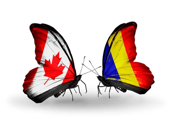 Zwei Schmetterlinge mit Flaggen auf Flügeln als Symbol der Beziehungen canada und chad, Rumänien — Stockfoto