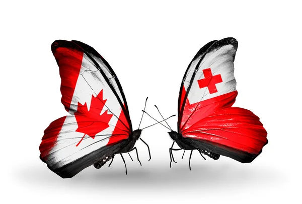 Δύο πεταλούδες με σημαίες με φτερά ως σύμβολο των σχέσεων, τον Καναδά και της Τόνγκα — Φωτογραφία Αρχείου