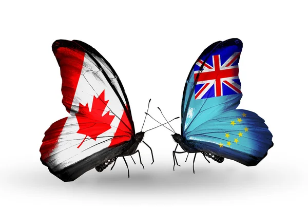 Two butterflies with flags on wings as symbol of relations Canada and Fiji — Stock Photo, Image