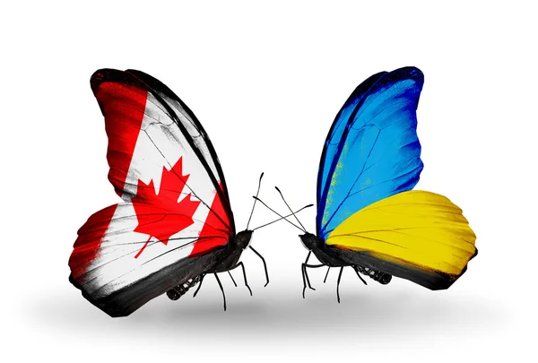 Deux papillons avec des drapeaux sur les ailes comme symbole des relations Canada-Ukraine — Photo